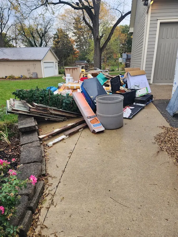 Dumpster being loaded with debris for Roofing Dumpster Rental in Phelan